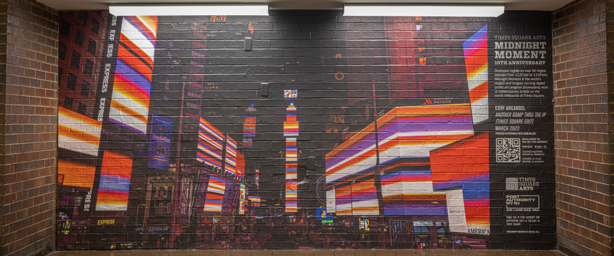 A photo of Cory Arcangel's "Another Romp Thru the IP" in Times Square, on display in Port Authority
